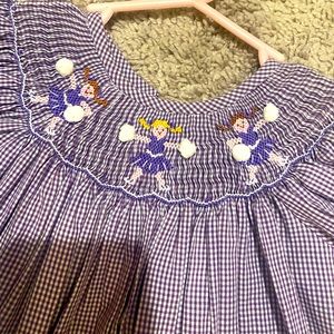 Purple smocked cheerleader dress 2T